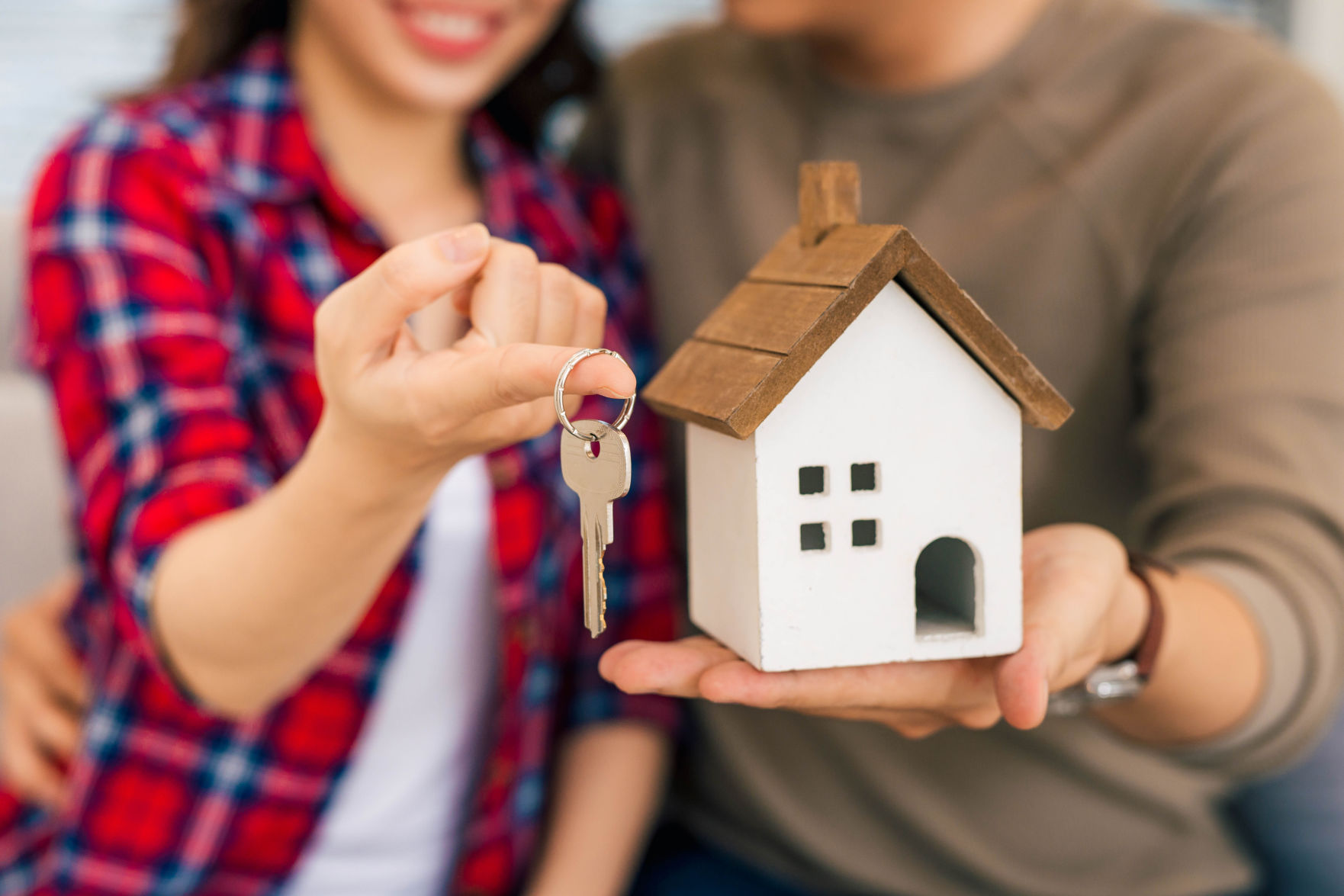 Couple with keys to new home